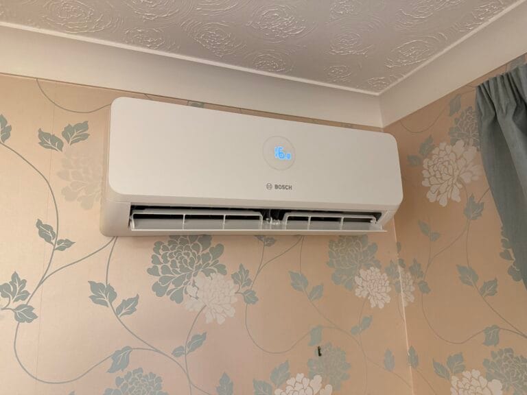 Bosch indoor air conditioning unit installed on a bedroom feature wall