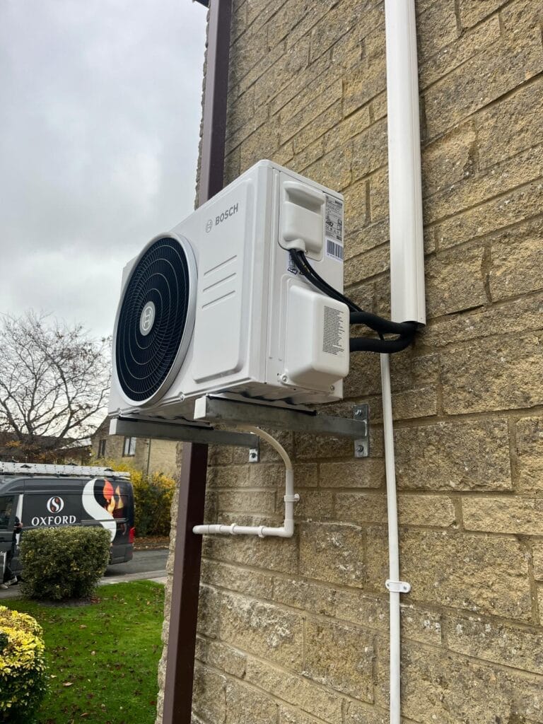 Bosch outdoor air conditioning condenser installed on galvanised wall brackets