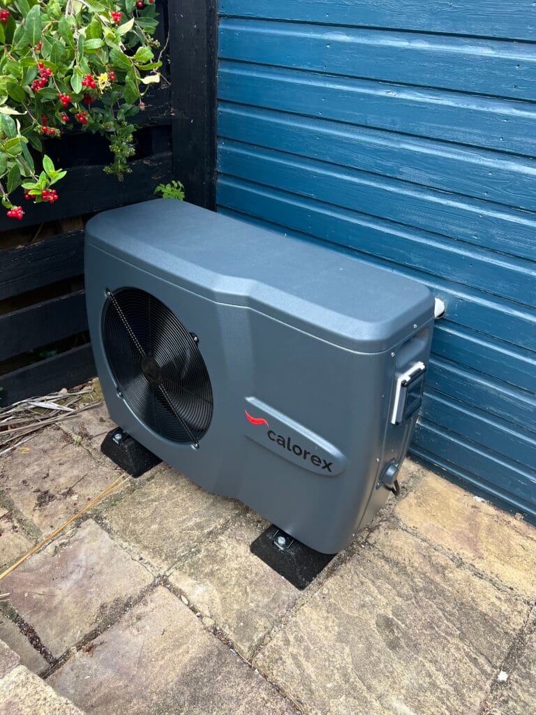 Close view of the new Calorex swimming-pool heat pump installed on anti-vibration feet