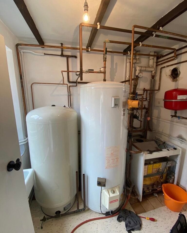 Old floor-standing boiler, hot water cylinder and accumulator before replacement