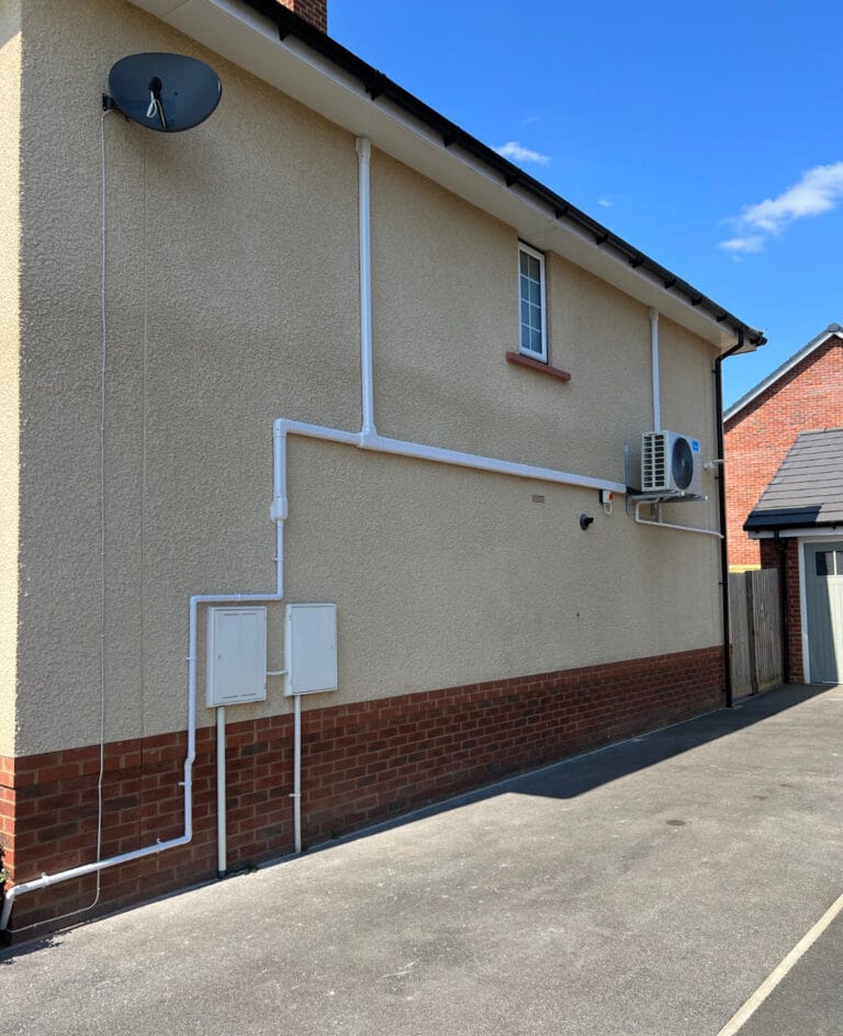Midea outdoor air conditioning unit with neatly routed external pipework
