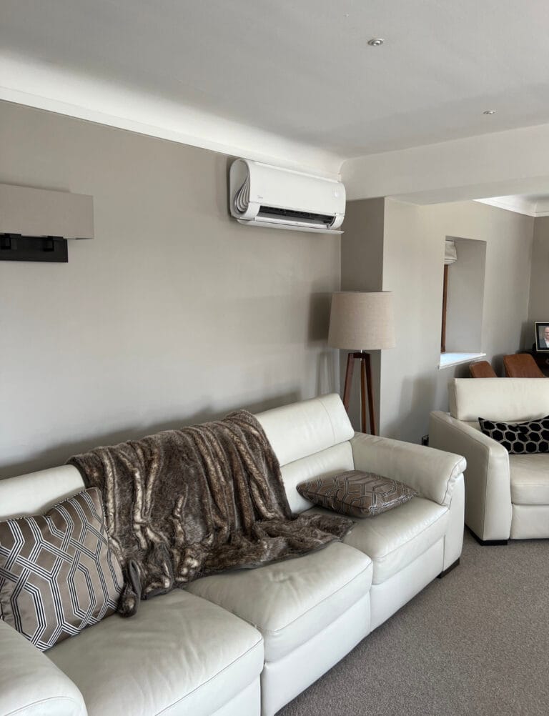 Midea wall-mounted indoor air conditioning unit installed in a living room