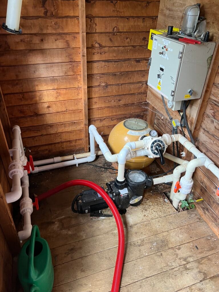 Existing swimming-pool media filter and pipework before replacement by Oxyplumb