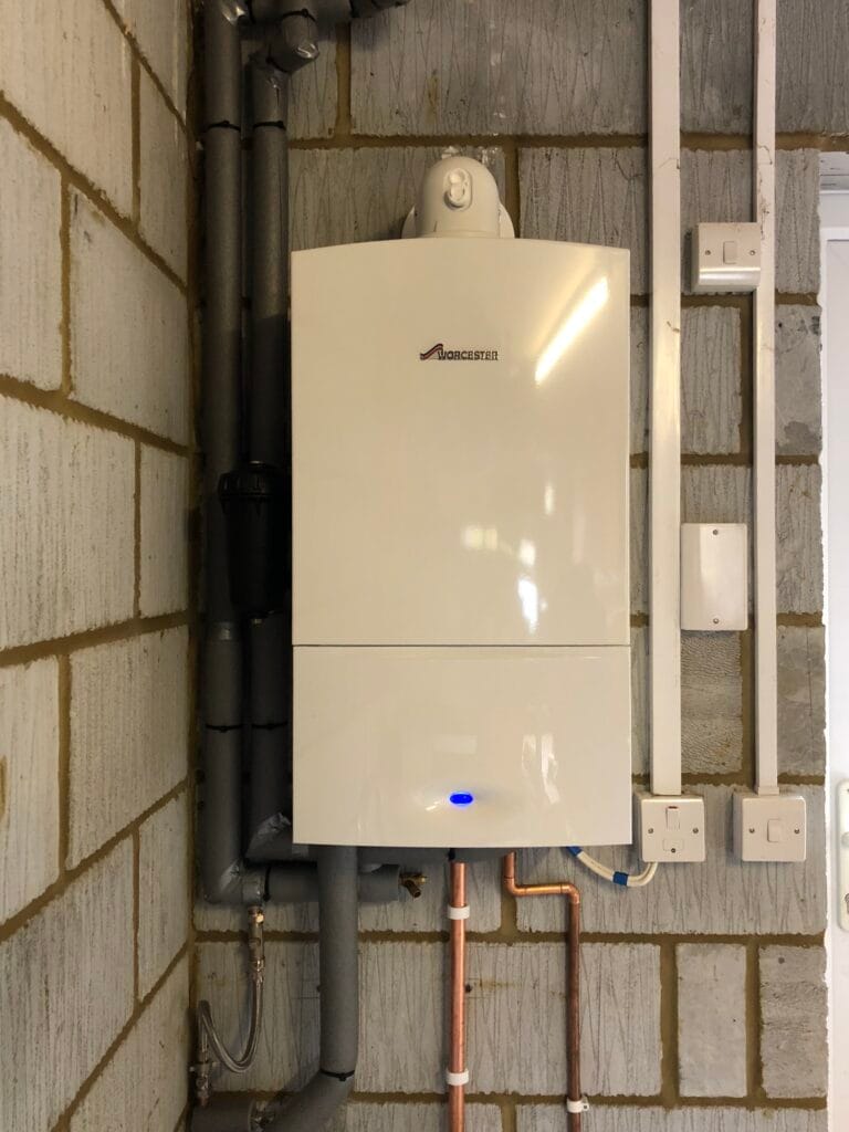 Worcester Bosch wall-mounted boiler installed with clean copper pipework